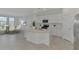 Modern kitchen with island and adjacent dining area at 10217 Staggerbush Dr # 202, Venice, FL 34293