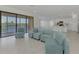 Bright living room with lake view and access to balcony at 10217 Staggerbush Dr # 202, Venice, FL 34293