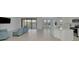Open living room with lake view and access to balcony at 10217 Staggerbush Dr # 202, Venice, FL 34293