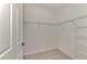 Large walk-in closet with wire shelving at 10217 Staggerbush Dr # 202, Venice, FL 34293