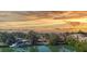 Scenic sunset view over waterfront homes, showcasing tranquil waterways at 107 Louella Ln, Nokomis, FL 34275