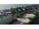Aerial view of waterfront property and beach at 107 Louella Ln, Nokomis, FL 34275