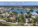 High-angle view of waterfront properties and surrounding landscape at 107 Louella Ln, Nokomis, FL 34275