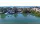 Aerial view showcasing waterfront property and boat at 107 Louella Ln, Nokomis, FL 34275