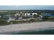 Aerial view of beach, waterway, and homes at 107 Louella Ln, Nokomis, FL 34275