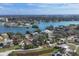 Wide shot of waterfront homes and community landscape with blue skies at 107 Louella Ln, Nokomis, FL 34275