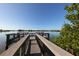 Wooden fishing deck overlooking calm water at 107 Louella Ln, Nokomis, FL 34275