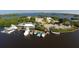 Aerial view of a marina with boats and docks at 107 Louella Ln, Nokomis, FL 34275