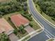 Single-story house with tile roof and brick driveway, aerial view at 11601 Parrotfish St, Venice, FL 34292