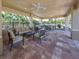 Covered patio with seating and lake view at 11601 Parrotfish St, Venice, FL 34292
