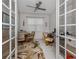 Home office with French doors, two work stations, and tile flooring at 11601 Parrotfish St, Venice, FL 34292