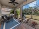 Enjoy this screened patio with seating area and backyard access at 11601 Parrotfish St, Venice, FL 34292