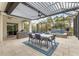 Al fresco dining area with table, chairs, and retractable pergola at 11678 Aucilla Dr, Venice, FL 34293