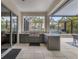 Outdoor kitchen with stainless steel appliances and granite countertops at 11678 Aucilla Dr, Venice, FL 34293