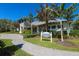 The Social Club: Resort-style clubhouse with welcoming entrance at 11678 Aucilla Dr, Venice, FL 34293