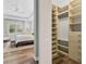 Bright walk-in closet with ample shelving and drawers at 11678 Aucilla Dr, Venice, FL 34293