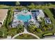 Aerial view of community pool, spa, and surrounding landscape at 12198 Wakulla Pl, Venice, FL 34293