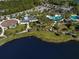 Aerial view of community pool and lakefront at 12198 Wakulla Pl, Venice, FL 34293