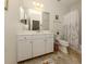 Clean bathroom with white vanity, tile floor, and shower/tub combo at 12198 Wakulla Pl, Venice, FL 34293