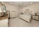 Main bedroom with king-size bed and en-suite bathroom at 12198 Wakulla Pl, Venice, FL 34293