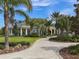 Community clubhouse with landscaped grounds and walkway at 12198 Wakulla Pl, Venice, FL 34293
