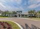 Grand Palm community clubhouse with palm trees at 12198 Wakulla Pl, Venice, FL 34293