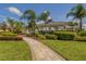 Stone path leading to a community pavilion and lush landscaping at 12198 Wakulla Pl, Venice, FL 34293