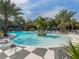 Relaxing pool area with palm trees and lounge chairs at 12198 Wakulla Pl, Venice, FL 34293