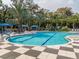 Resort-style pool with checkered patio and palm trees at 12198 Wakulla Pl, Venice, FL 34293