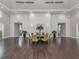 Community room with wood floors and seating areas at 12198 Wakulla Pl, Venice, FL 34293