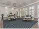 Bright community room with tables and chairs at 12198 Wakulla Pl, Venice, FL 34293