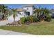 Single-story home with two-car garage and landscaped yard at 12198 Wakulla Pl, Venice, FL 34293