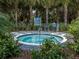 Circular hot tub surrounded by landscaping at 12198 Wakulla Pl, Venice, FL 34293