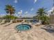 Community hot tub with lounge chairs and lake views at 12198 Wakulla Pl, Venice, FL 34293