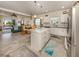 Bright kitchen with white cabinets, stainless steel appliances, and an island at 12198 Wakulla Pl, Venice, FL 34293