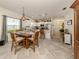 Open concept kitchen with white cabinets and stainless steel appliances at 12198 Wakulla Pl, Venice, FL 34293