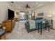 Spacious living room with teal sectional sofa and large TV at 12198 Wakulla Pl, Venice, FL 34293