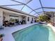 Inviting screened-in pool with ample lounging space at 12198 Wakulla Pl, Venice, FL 34293
