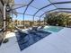 Screened-in pool and patio with comfortable seating at 12198 Wakulla Pl, Venice, FL 34293
