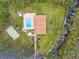 Bird's-eye view showing pool, clubhouse, and kayak storage at 1236 Pinebrook Way, Venice, FL 34285
