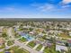 Wide aerial shot of the property and surrounding community at 1236 Pinebrook Way, Venice, FL 34285