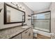 Bathroom boasts granite countertop, tiled shower and new fixtures at 1236 Pinebrook Way, Venice, FL 34285