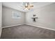 Spacious bedroom with wall-mounted shelving and ceiling fan at 1236 Pinebrook Way, Venice, FL 34285