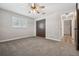 Well-lit bedroom with plush carpet and a double door closet at 1236 Pinebrook Way, Venice, FL 34285