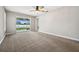 Primary bedroom with sliding glass doors leading to the backyard at 1236 Pinebrook Way, Venice, FL 34285