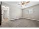 Large bedroom featuring neutral walls and plush carpeting at 1236 Pinebrook Way, Venice, FL 34285