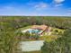 Community pool and clubhouse with shuffleboard courts at 1236 Pinebrook Way, Venice, FL 34285
