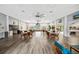Large community room with tables and chairs at 1236 Pinebrook Way, Venice, FL 34285