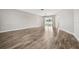 Spacious dining room with wood-look floors and access to a sliding glass door at 1236 Pinebrook Way, Venice, FL 34285