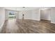 Large dining room featuring wood-look floors and views of the backyard at 1236 Pinebrook Way, Venice, FL 34285